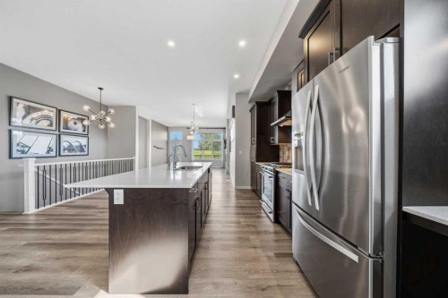 240 D'Arcy Ranch Drive, Okotoks, AB - Indoor Photo Showing Kitchen With Stainless Steel Kitchen With Upgraded Kitchen