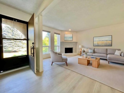 58 Canterbury Gardens Sw, Calgary, AB - Indoor Photo Showing Living Room With Fireplace