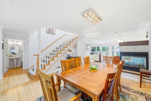 721 27 Avenue Nw, Calgary, AB - Indoor Photo Showing Dining Room With Fireplace