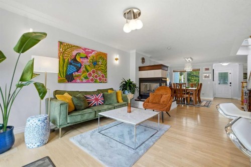 721 27 Avenue Nw, Calgary, AB - Indoor Photo Showing Living Room With Fireplace