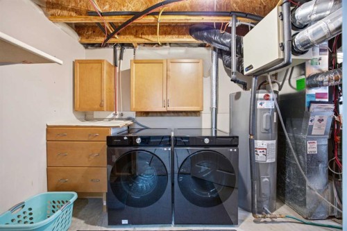 336 Silverado Drive Sw, Calgary, AB - Indoor Photo Showing Laundry Room