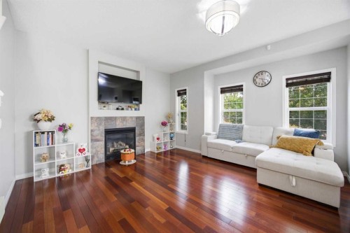 336 Silverado Drive Sw, Calgary, AB - Indoor Photo Showing Living Room With Fireplace