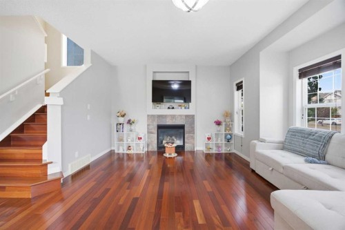 336 Silverado Drive Sw, Calgary, AB - Indoor Photo Showing Living Room With Fireplace