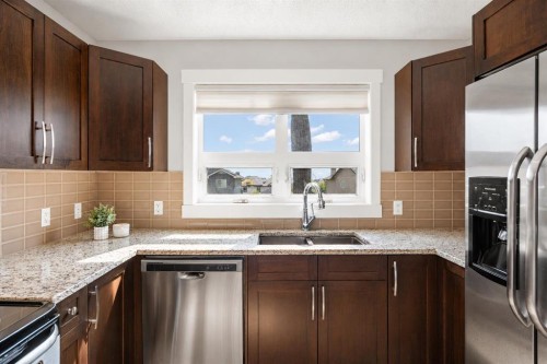 230 Covecreek Circle Ne, Calgary, AB - Indoor Photo Showing Kitchen With Stainless Steel Kitchen With Double Sink With Upgraded Kitchen
