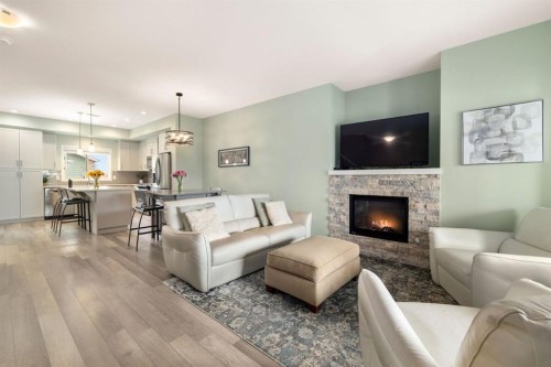719 Mahogany Boulevard Se, Calgary, AB - Indoor Photo Showing Living Room With Fireplace