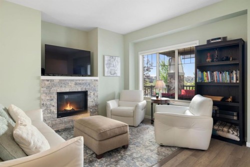 719 Mahogany Boulevard Se, Calgary, AB - Indoor Photo Showing Living Room With Fireplace