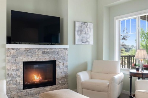 719 Mahogany Boulevard Se, Calgary, AB - Indoor Photo Showing Living Room With Fireplace