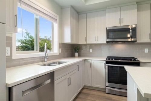 719 Mahogany Boulevard Se, Calgary, AB - Indoor Photo Showing Kitchen With Stainless Steel Kitchen With Double Sink With Upgraded Kitchen