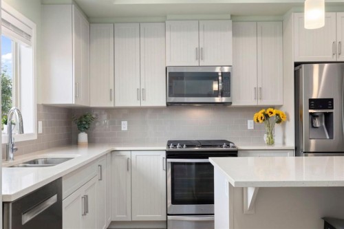 719 Mahogany Boulevard Se, Calgary, AB - Indoor Photo Showing Kitchen With Stainless Steel Kitchen With Double Sink With Upgraded Kitchen