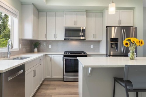 719 Mahogany Boulevard Se, Calgary, AB - Indoor Photo Showing Kitchen With Stainless Steel Kitchen With Double Sink With Upgraded Kitchen