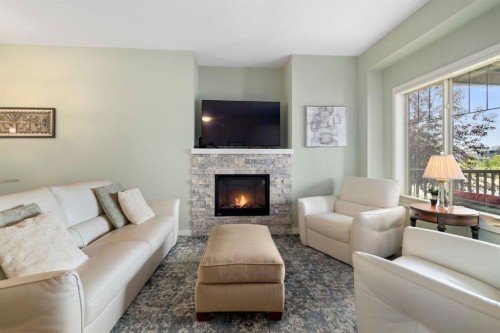 719 Mahogany Boulevard Se, Calgary, AB - Indoor Photo Showing Living Room With Fireplace