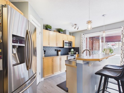 2049 New Brighton Gardens Se, Calgary, AB - Indoor Photo Showing Kitchen With Upgraded Kitchen