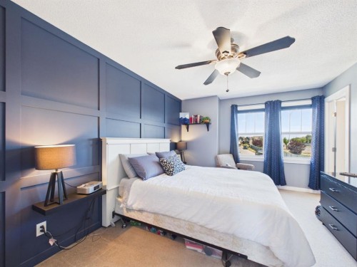 2049 New Brighton Gardens Se, Calgary, AB - Indoor Photo Showing Bedroom