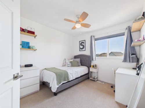 2049 New Brighton Gardens Se, Calgary, AB - Indoor Photo Showing Bedroom