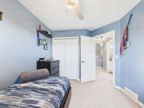 2049 New Brighton Gardens Se, Calgary, AB - Indoor Photo Showing Bedroom