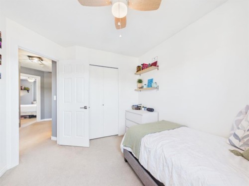 2049 New Brighton Gardens Se, Calgary, AB - Indoor Photo Showing Bedroom