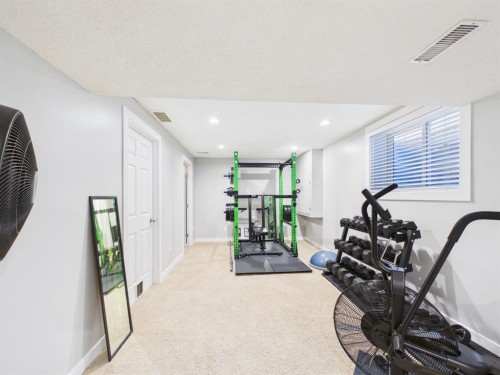 2049 New Brighton Gardens Se, Calgary, AB - Indoor Photo Showing Gym Room