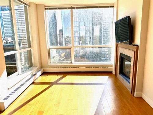 1615-222 Riverfront Avenue Sw, Calgary, AB - Indoor With Fireplace