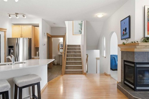 54 Rockyledge Rise Nw, Calgary, AB - Indoor With Fireplace