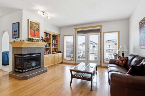 54 Rockyledge Rise Nw, Calgary, AB - Indoor Photo Showing Living Room With Fireplace