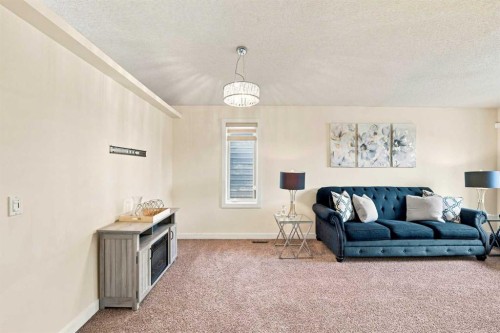 225 Harvest Glen Place Ne, Calgary, AB - Indoor Photo Showing Living Room