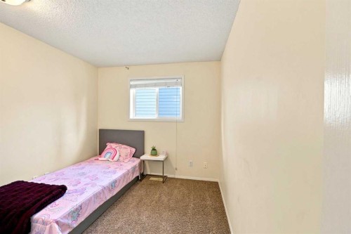 225 Harvest Glen Place Ne, Calgary, AB - Indoor Photo Showing Bedroom