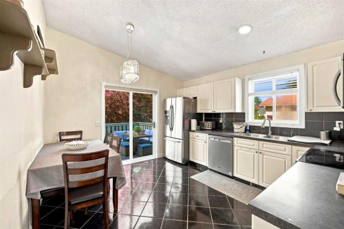 225 Harvest Glen Place Ne, Calgary, AB - Indoor Photo Showing Kitchen With Double Sink