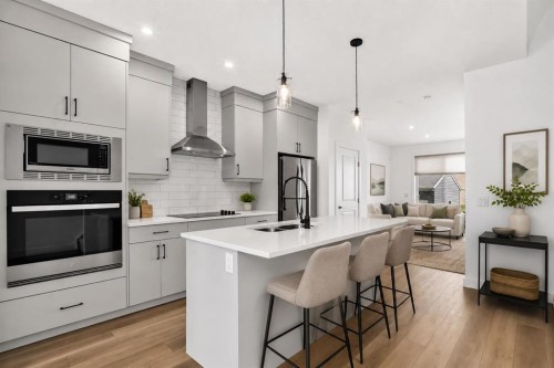 125 Herron Mews Ne, Calgary, AB - Indoor Photo Showing Kitchen With Stainless Steel Kitchen With Double Sink With Upgraded Kitchen