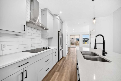 125 Herron Mews Ne, Calgary, AB - Indoor Photo Showing Kitchen With Double Sink With Upgraded Kitchen