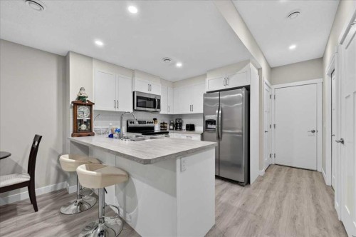 97 Seton Manor Se, Calgary, AB - Indoor Photo Showing Kitchen With Double Sink