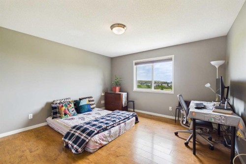 169 Brightonwoods Gardens Se, Calgary, AB - Indoor Photo Showing Bedroom