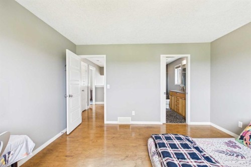 169 Brightonwoods Gardens Se, Calgary, AB - Indoor Photo Showing Bedroom