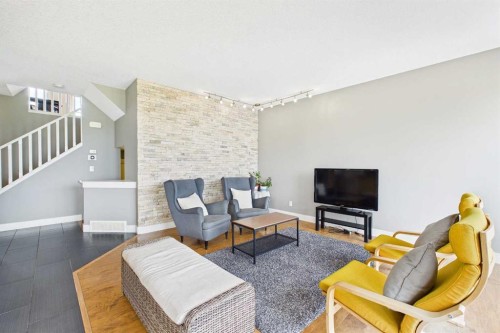 169 Brightonwoods Gardens Se, Calgary, AB - Indoor Photo Showing Living Room