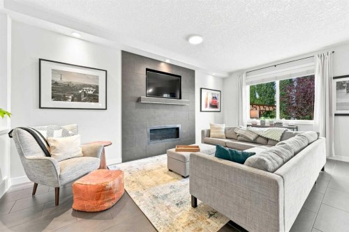 4 Silverado Saddle Court Sw, Calgary, AB - Indoor Photo Showing Living Room With Fireplace