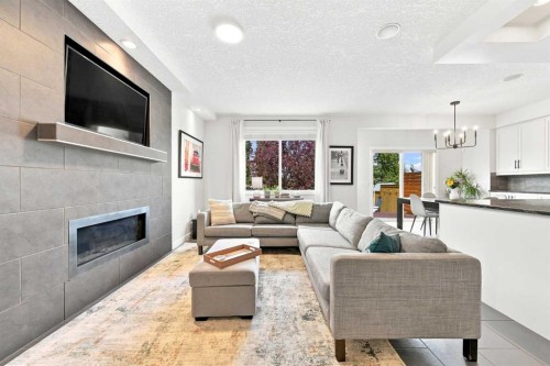 4 Silverado Saddle Court Sw, Calgary, AB - Indoor Photo Showing Living Room With Fireplace