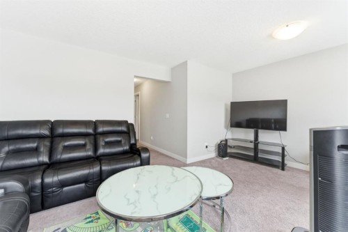 14 Belvedere Point Se, Calgary, AB - Indoor Photo Showing Living Room