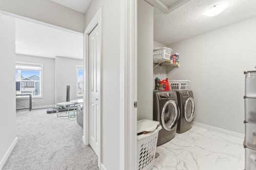 14 Belvedere Point Se, Calgary, AB - Indoor Photo Showing Laundry Room