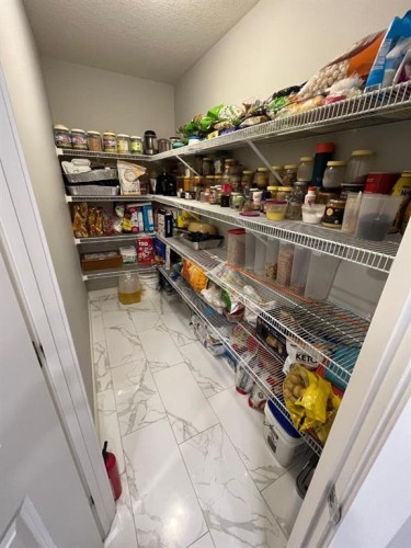 14 Belvedere Point Se, Calgary, AB - Indoor With Storage