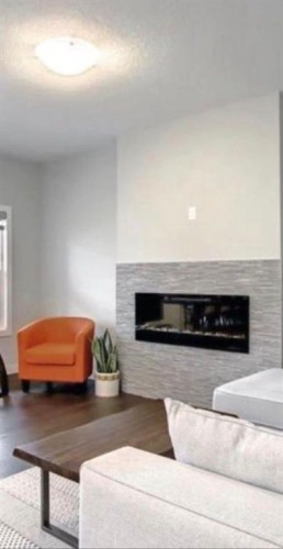 14 Belvedere Point Se, Calgary, AB - Indoor Photo Showing Living Room With Fireplace