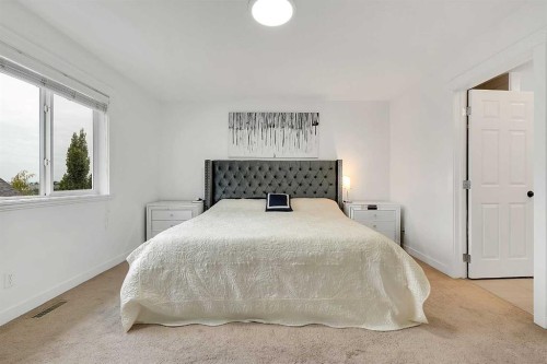 6 Aspen Stone Mews Sw, Calgary, AB - Indoor Photo Showing Bedroom