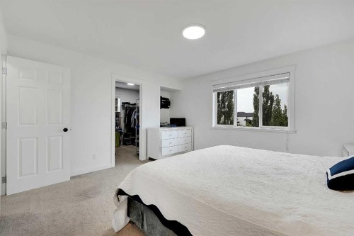 6 Aspen Stone Mews Sw, Calgary, AB - Indoor Photo Showing Bedroom