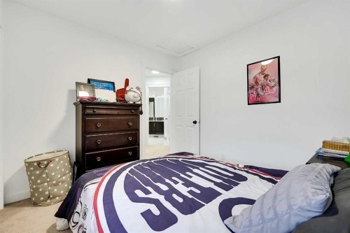 6 Aspen Stone Mews Sw, Calgary, AB - Indoor Photo Showing Bedroom