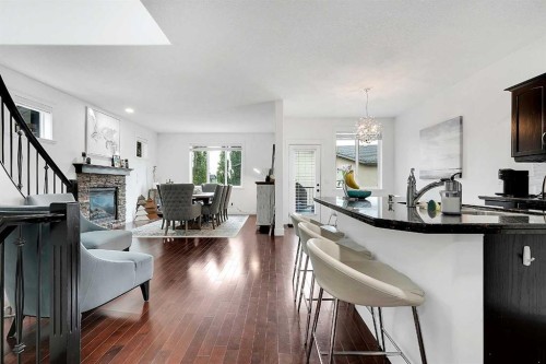 6 Aspen Stone Mews Sw, Calgary, AB - Indoor Photo Showing Living Room With Fireplace