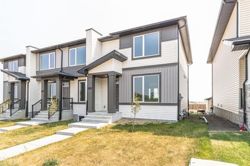 1995 Mccaskill Drive, Crossfield, AB - Outdoor With Facade