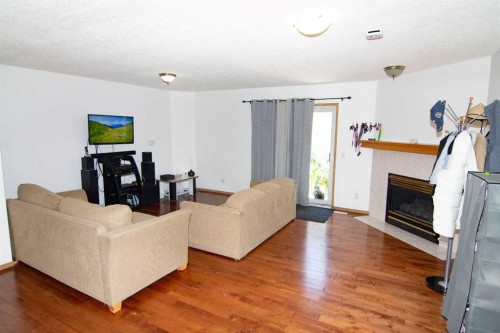 3850 Catalina Boulevard Ne, Calgary, AB - Indoor Photo Showing Living Room With Fireplace