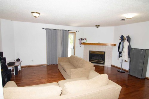3850 Catalina Boulevard Ne, Calgary, AB - Indoor Photo Showing Living Room With Fireplace