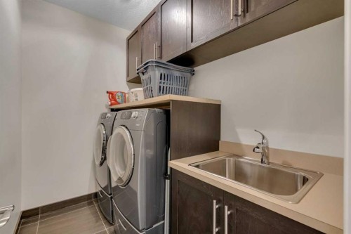 72 Quarry Landing Se, Calgary, AB - Indoor Photo Showing Laundry Room