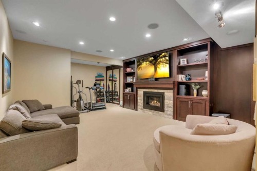 72 Quarry Landing Se, Calgary, AB - Indoor With Fireplace