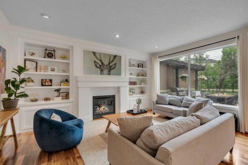 72 Quarry Landing Se, Calgary, AB - Indoor Photo Showing Living Room With Fireplace