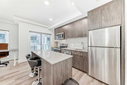 204-455 1 Avenue Ne, Calgary, AB - Indoor Photo Showing Kitchen With Stainless Steel Kitchen With Upgraded Kitchen